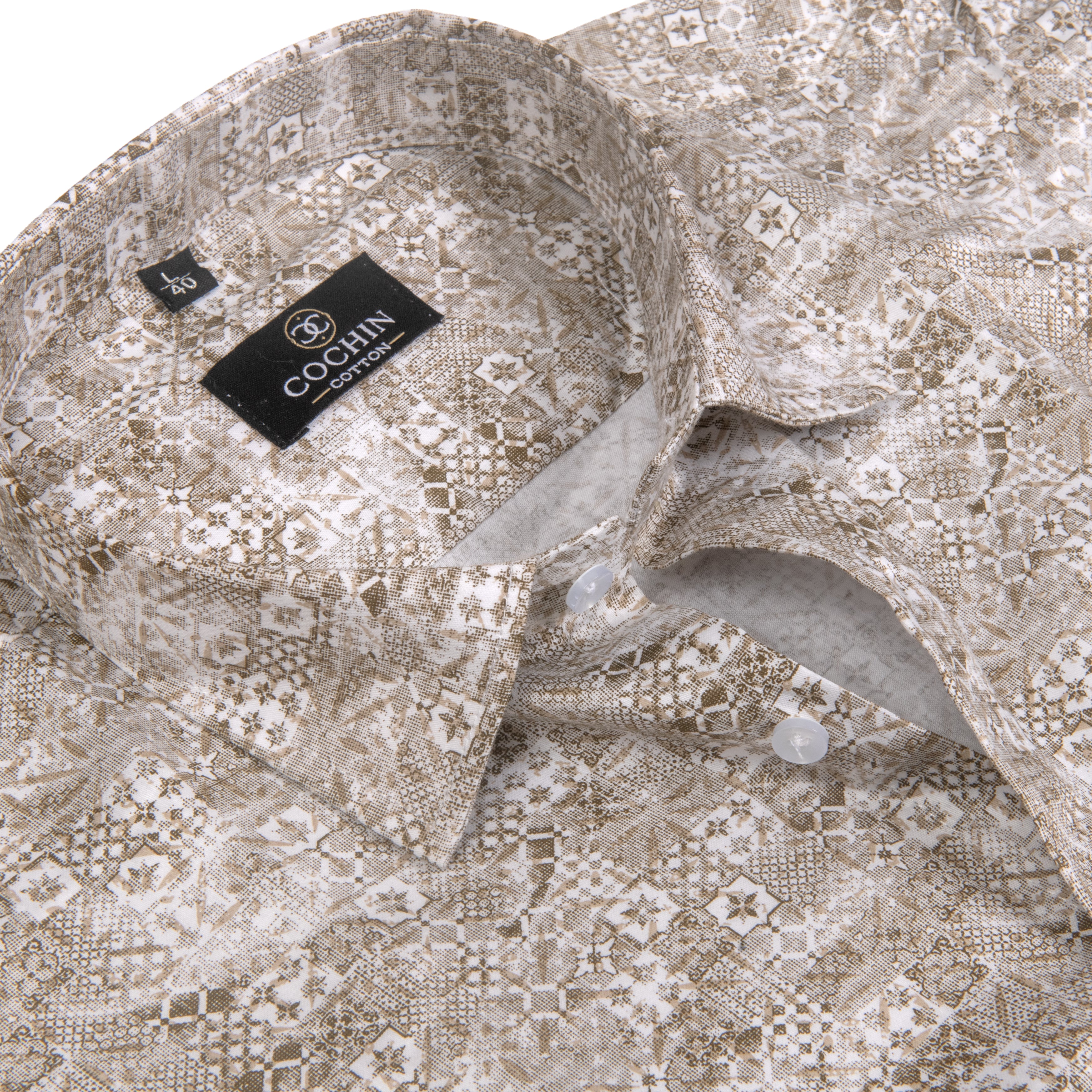 Close-up of a Cochin brand button-down shirt collar and upper chest area, showing a beige and brown snakeskin-style pattern on a white base.