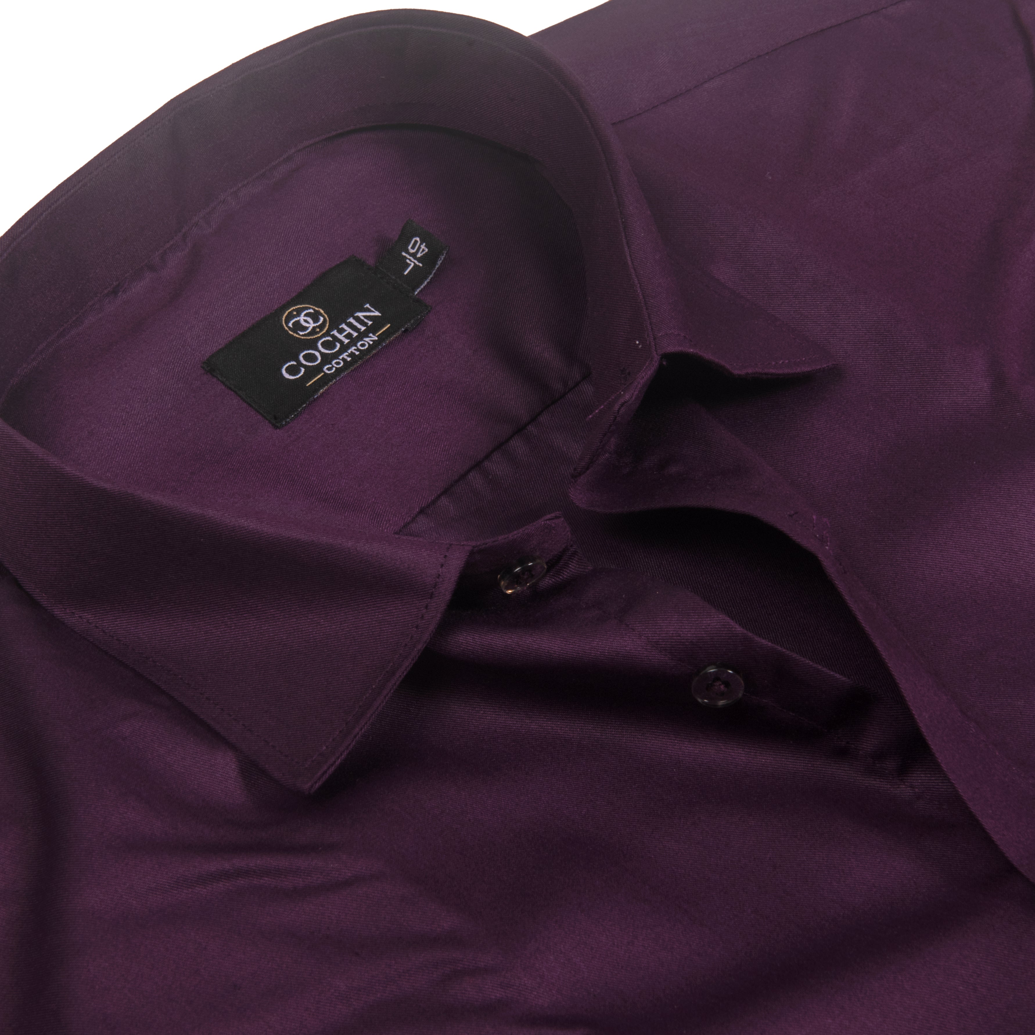 A close-up of a dark purple dress shirt by Cochin Garment, showing the collar, inner neck label, and buttoned front.