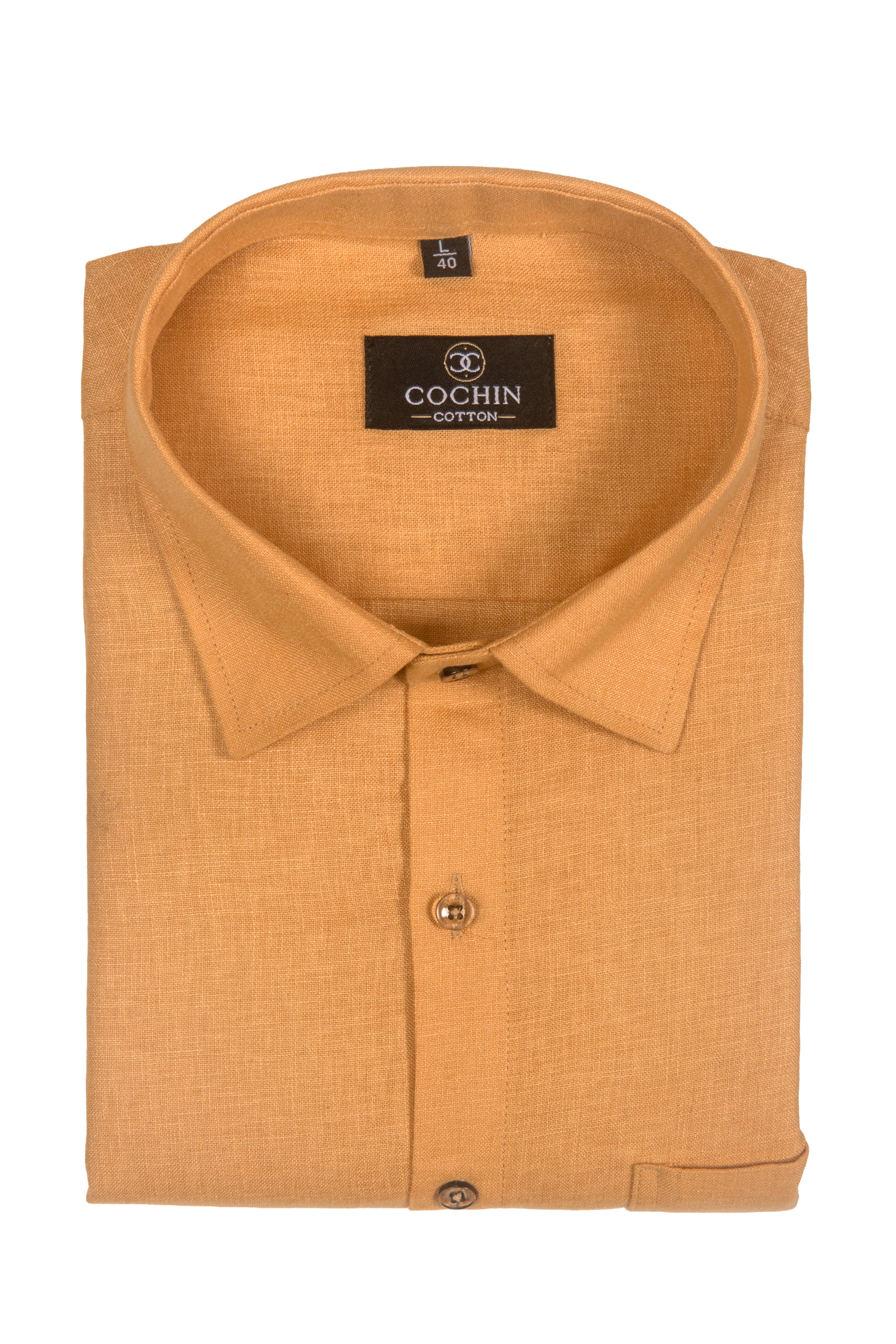 A folded Cochin Cotton long-sleeve shirt in a warm mustard yellow color, showing the collar, button placket, and brand label against a plain white background.