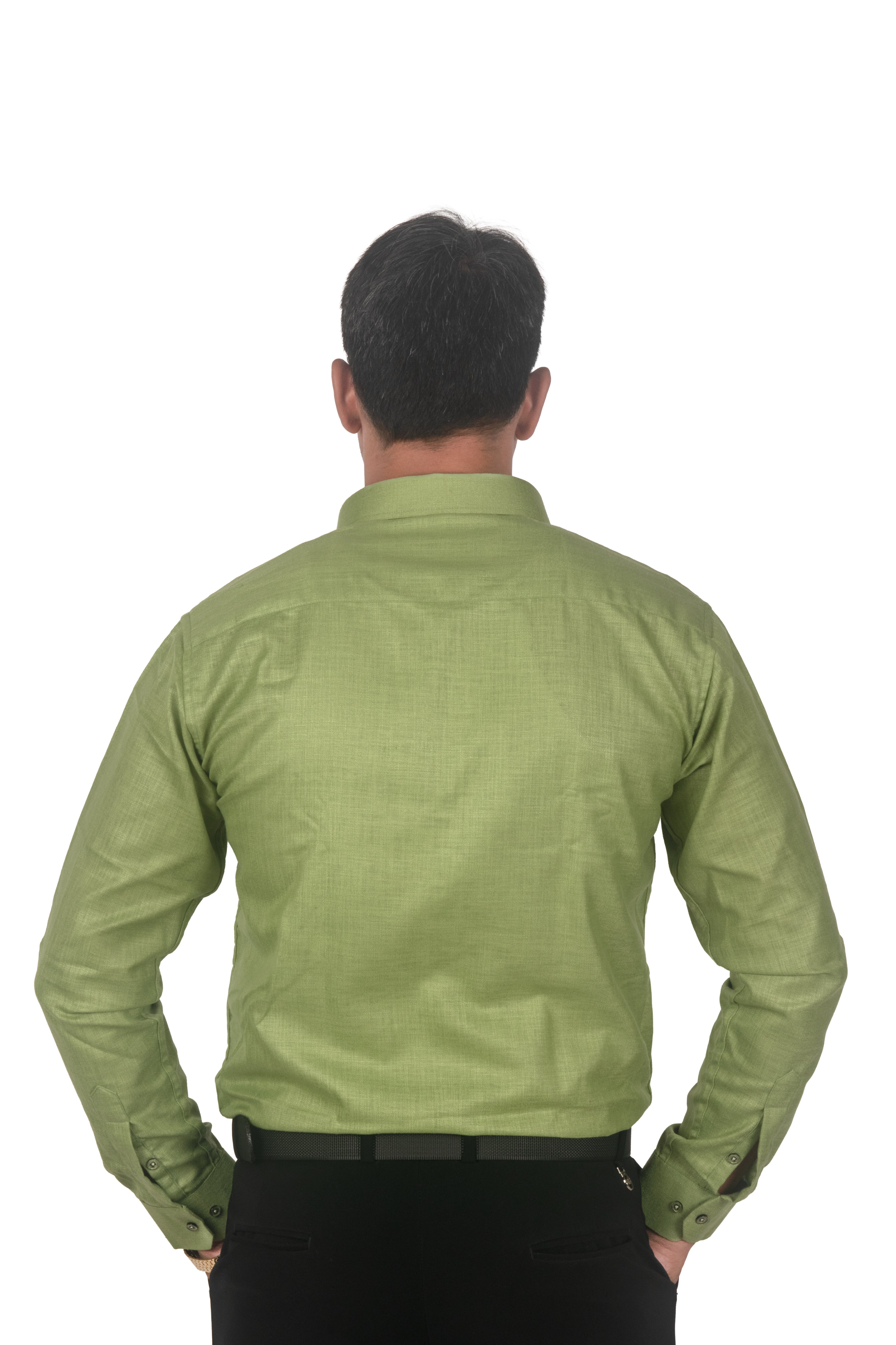 A man viewed from the back wearing a light olive green long-sleeve button-up shirt and black trousers, isolated on a white background.