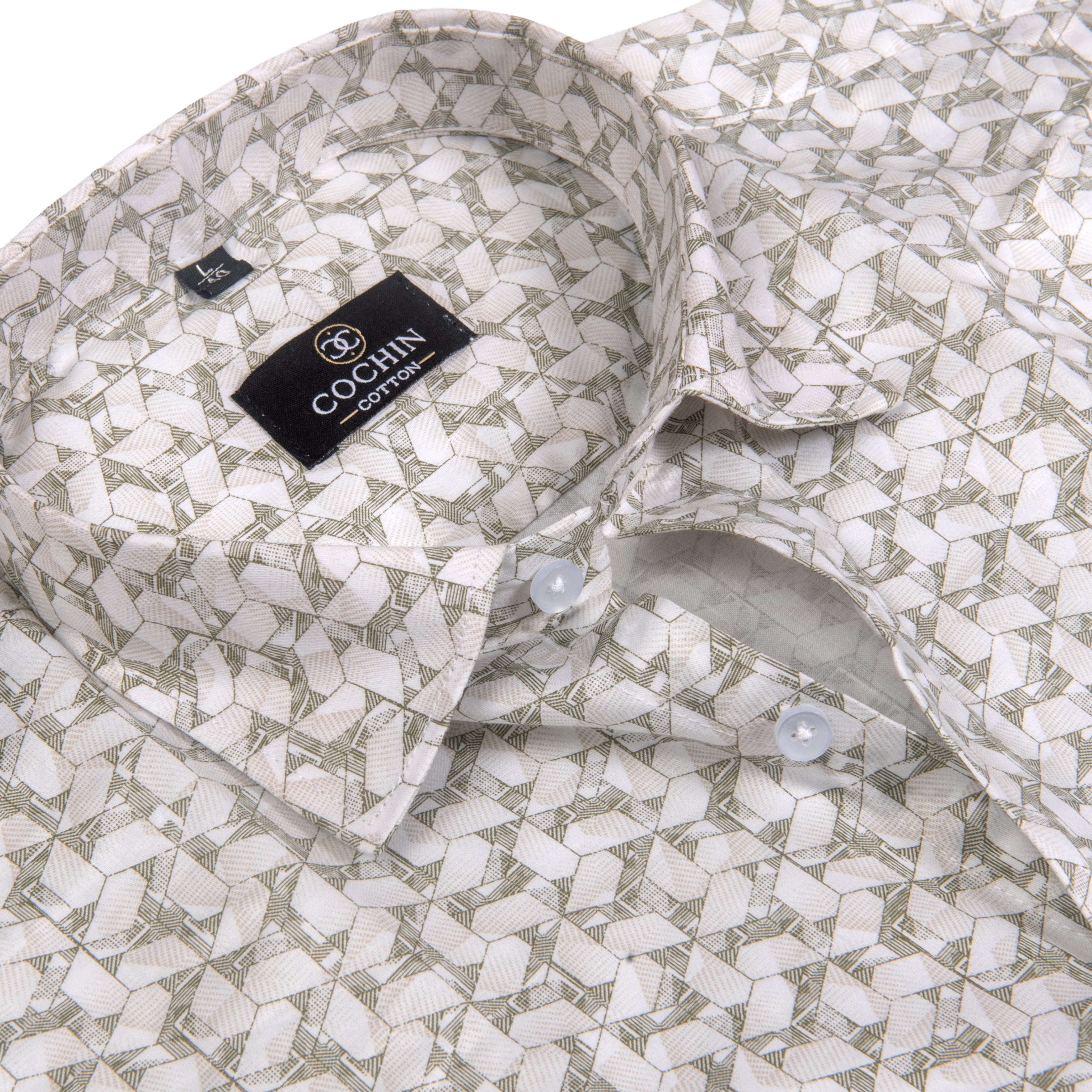 A close-up of a men's dress shirt by C.Cohlin, featuring a geometric pattern in beige and muted sage green.