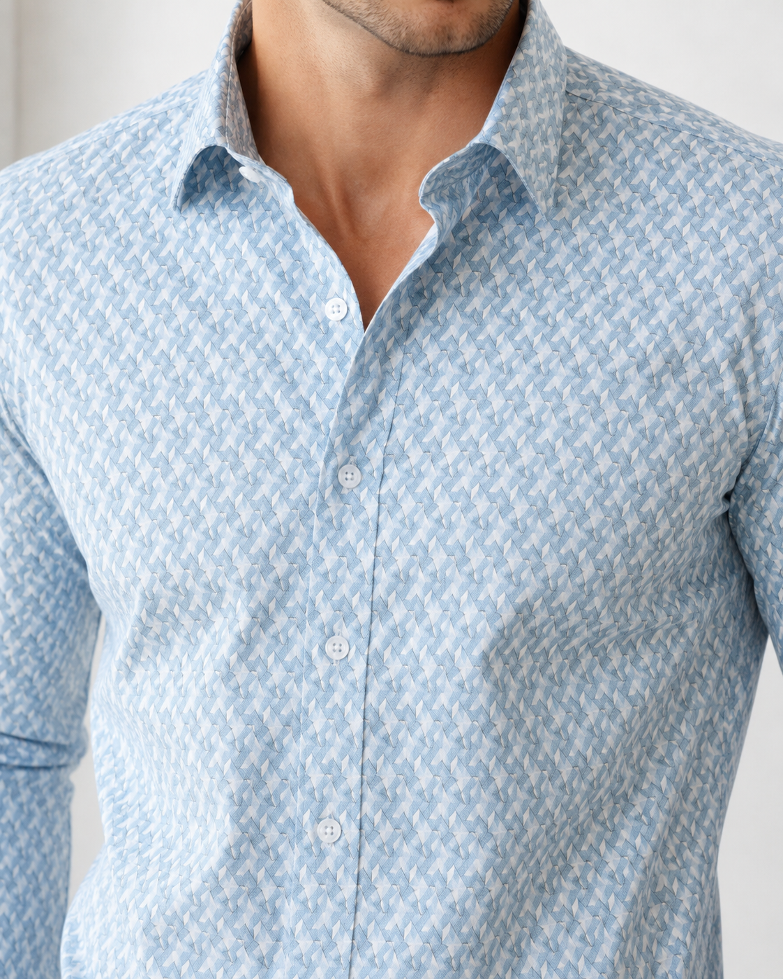 Close-up of a light blue patterned shirt worn by a person