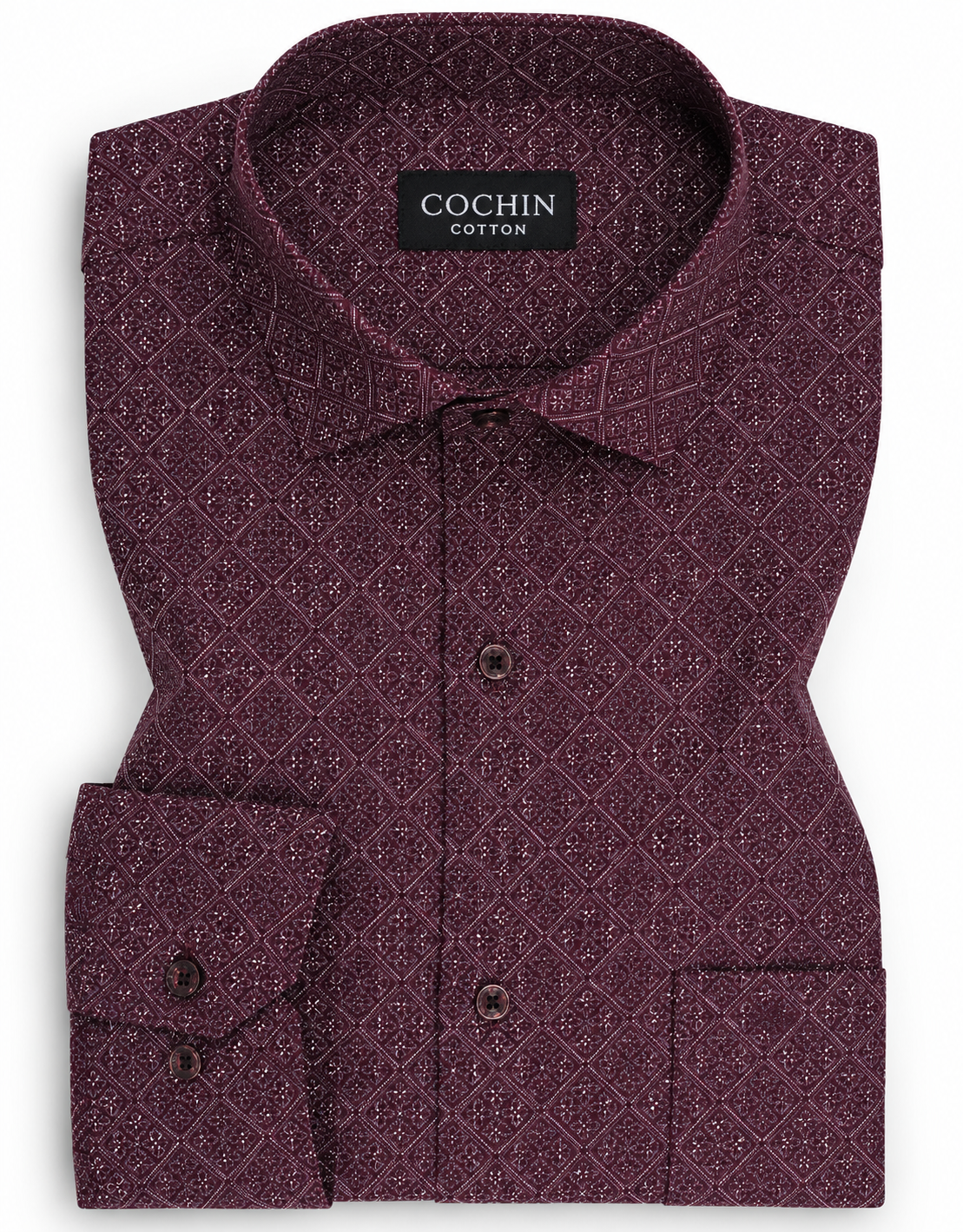 Folded purple patterned shirt with 'Cochin Cotton' label on a white background