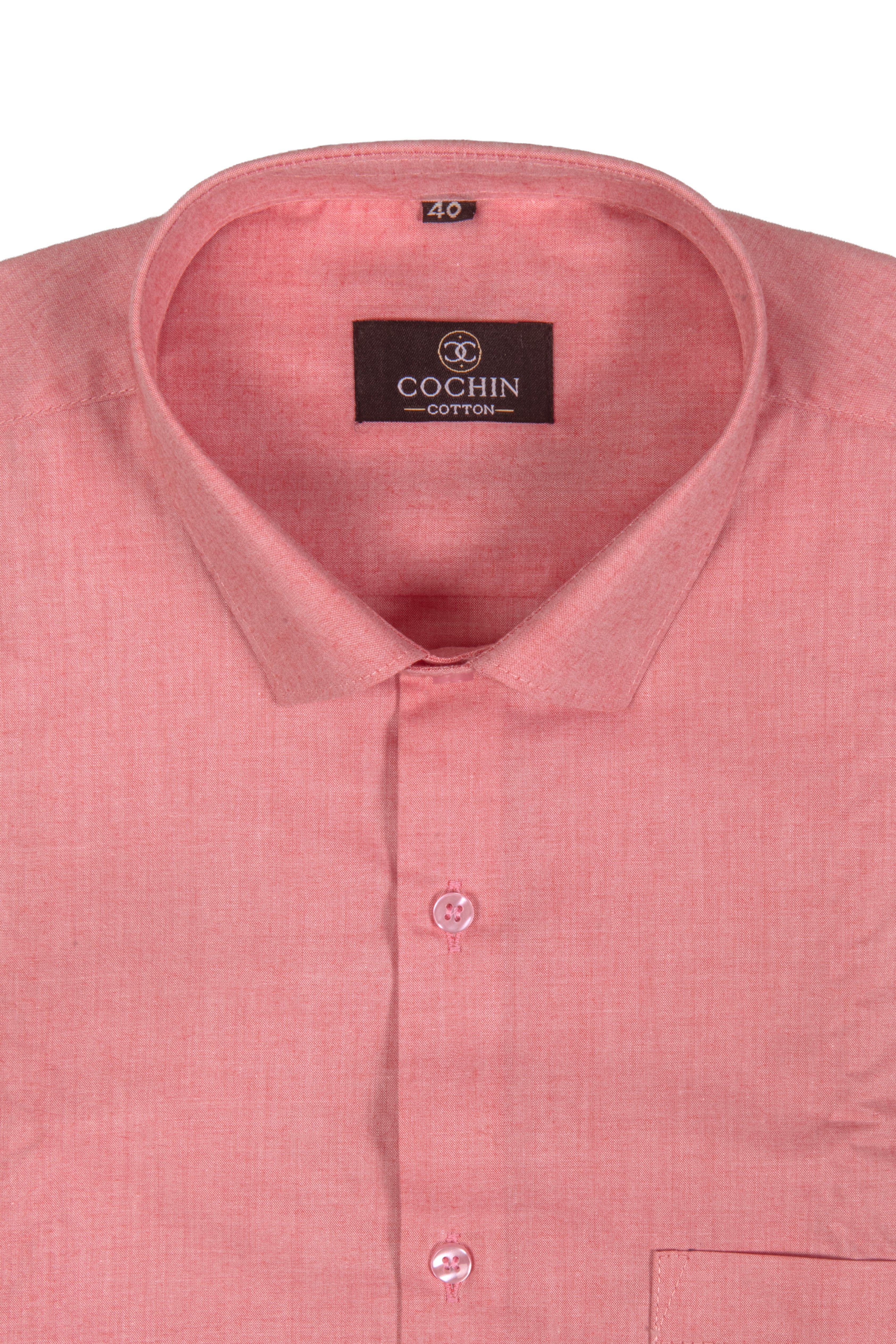 A close-up of a pink Cochin cotton dress shirt showing the collar, brand label, and front buttons against a white background.