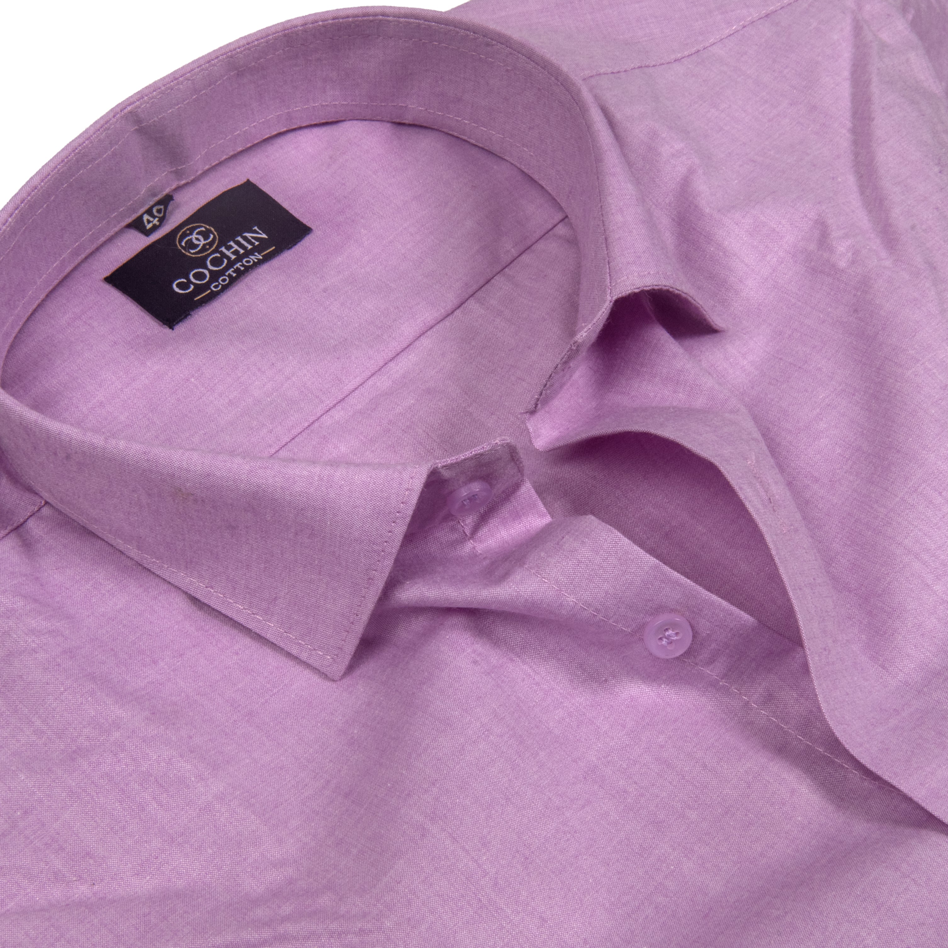 A close-up of a light purple dress shirt by Cochin Couture, showing the collar, inner neck label, and buttoned placket against a clean white background.