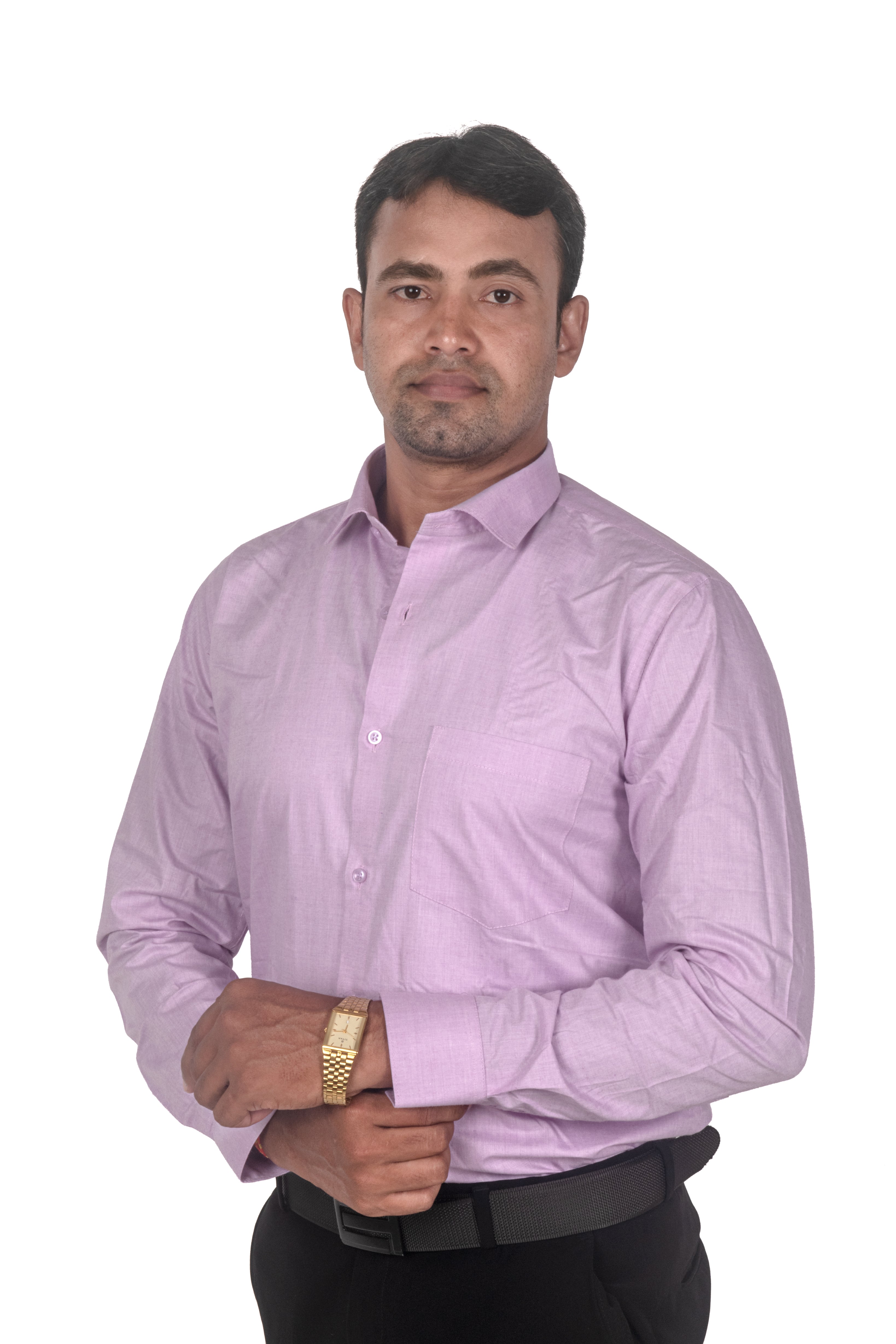 A man wearing a light purple long-sleeve button-down dress shirt, black trousers, and a gold watch, standing against a plain white background.