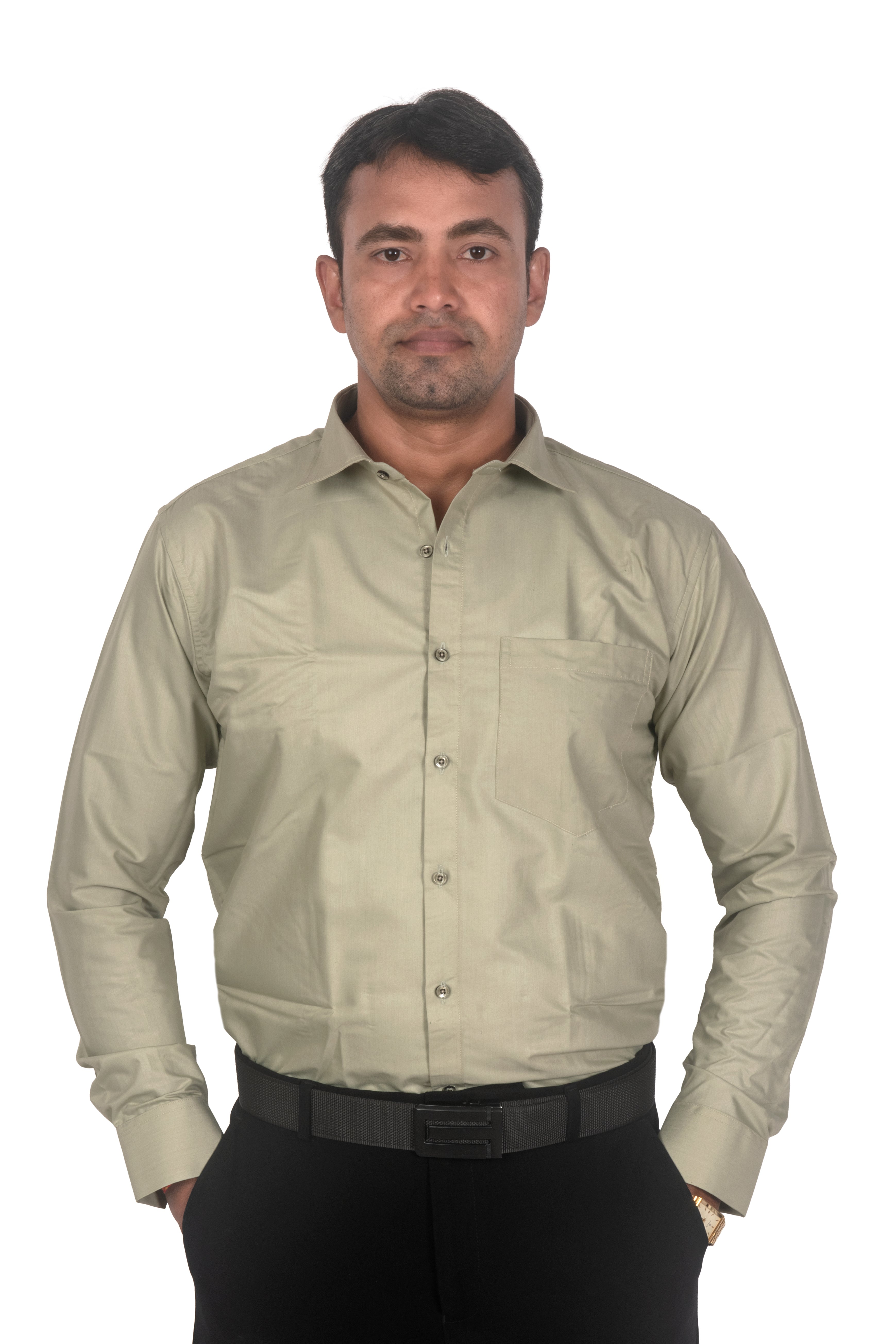A man wearing a light beige long-sleeve button-down shirt and black trousers, standing against a plain white background.