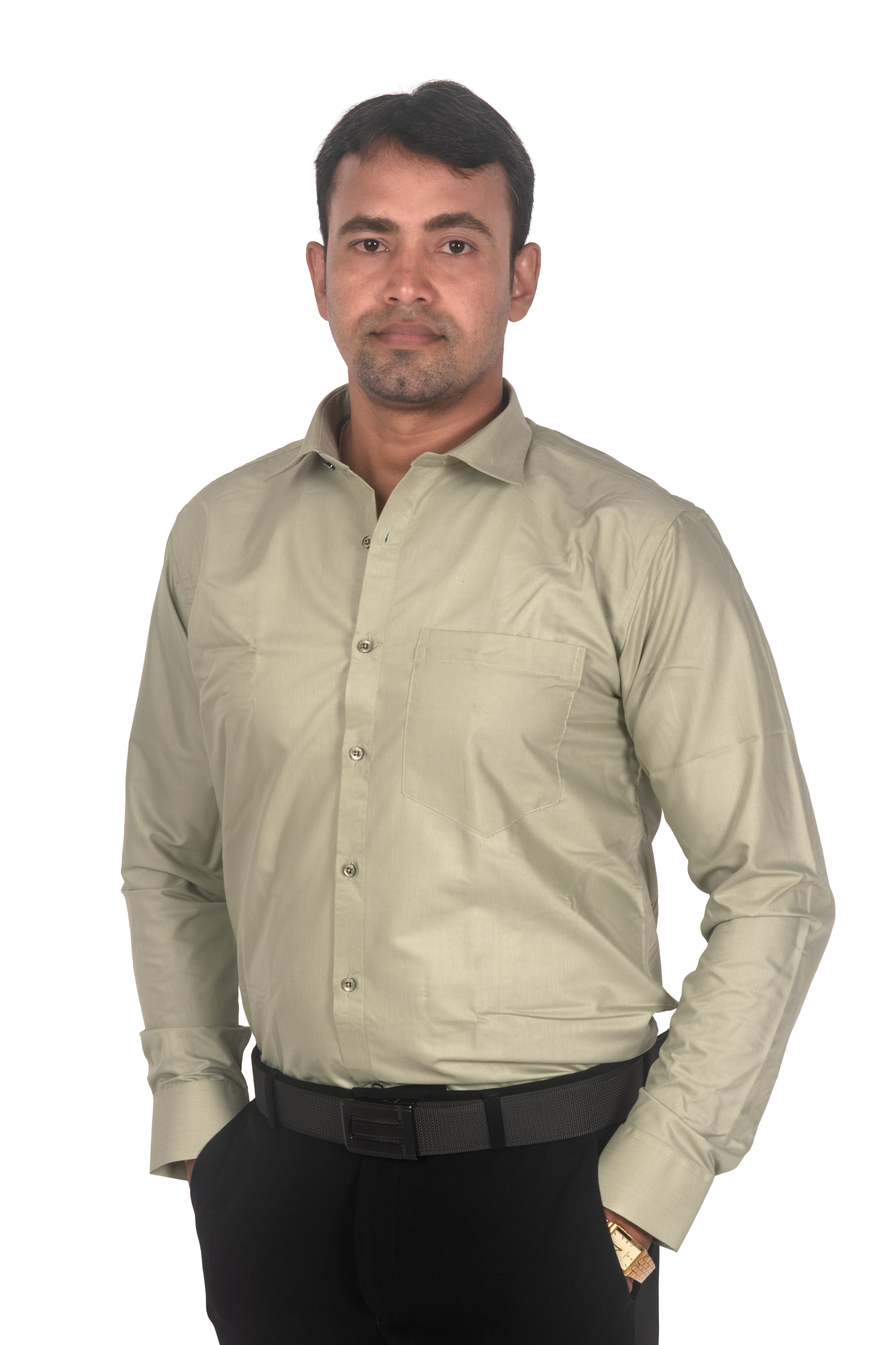A man wearing a light beige long-sleeve button-down shirt and black trousers, standing against a plain white background.