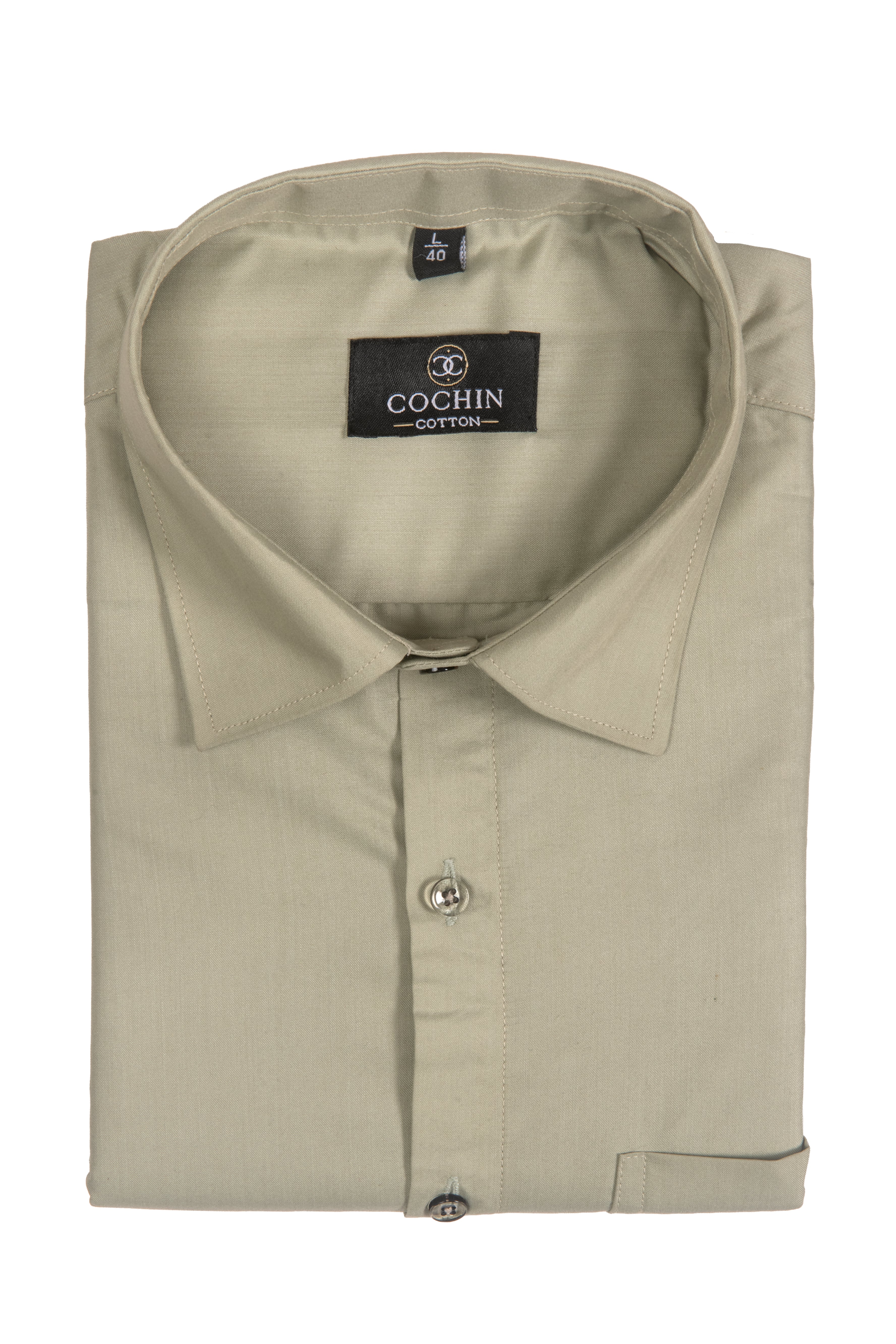 A folded light beige long-sleeve cotton dress shirt with a pointed collar and button-down front, featuring a visible Cochin Cotton brand label.