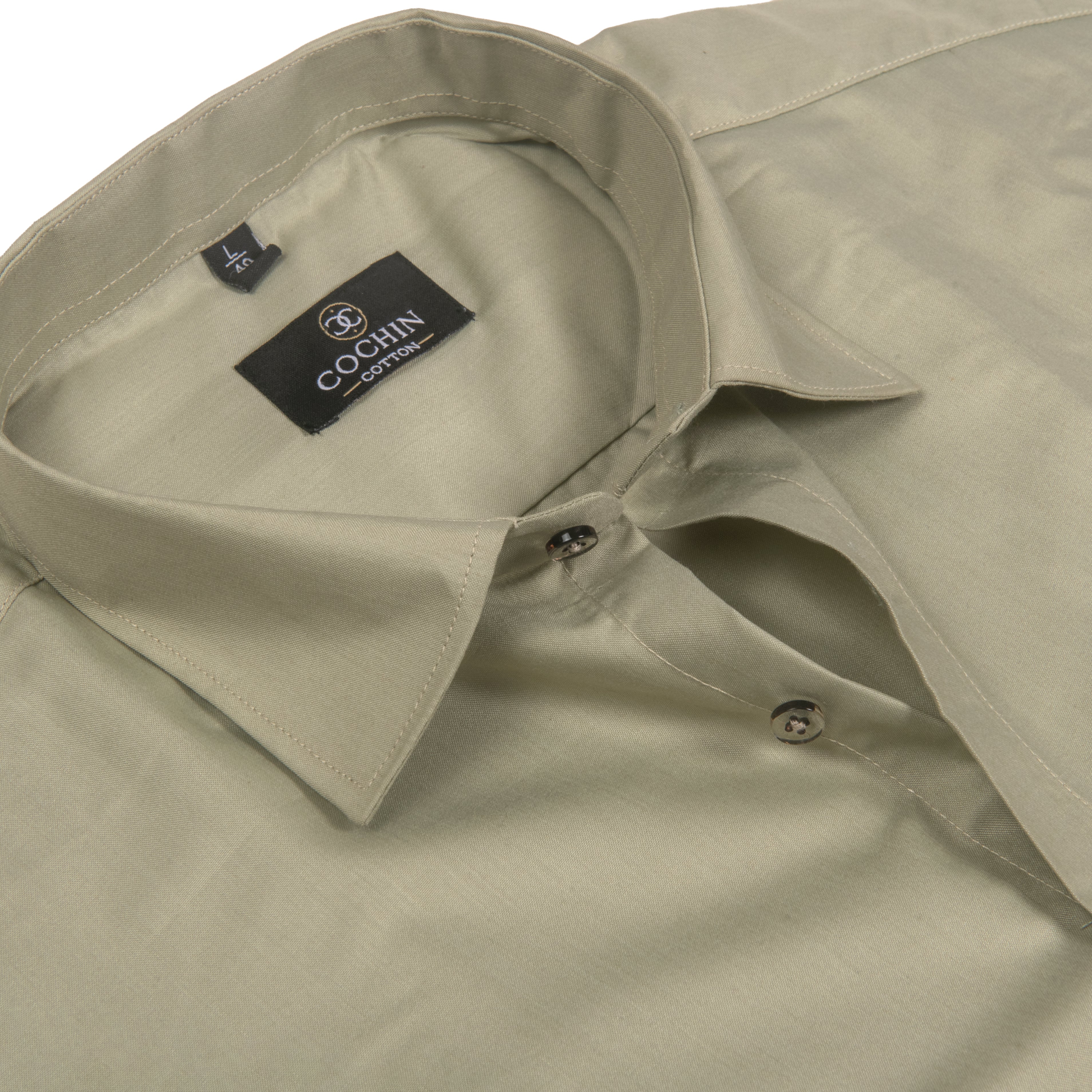 A close-up of a light khaki-colored dress shirt by Cociin, showing the collar, inner neck label, and buttoned placket against a white background.