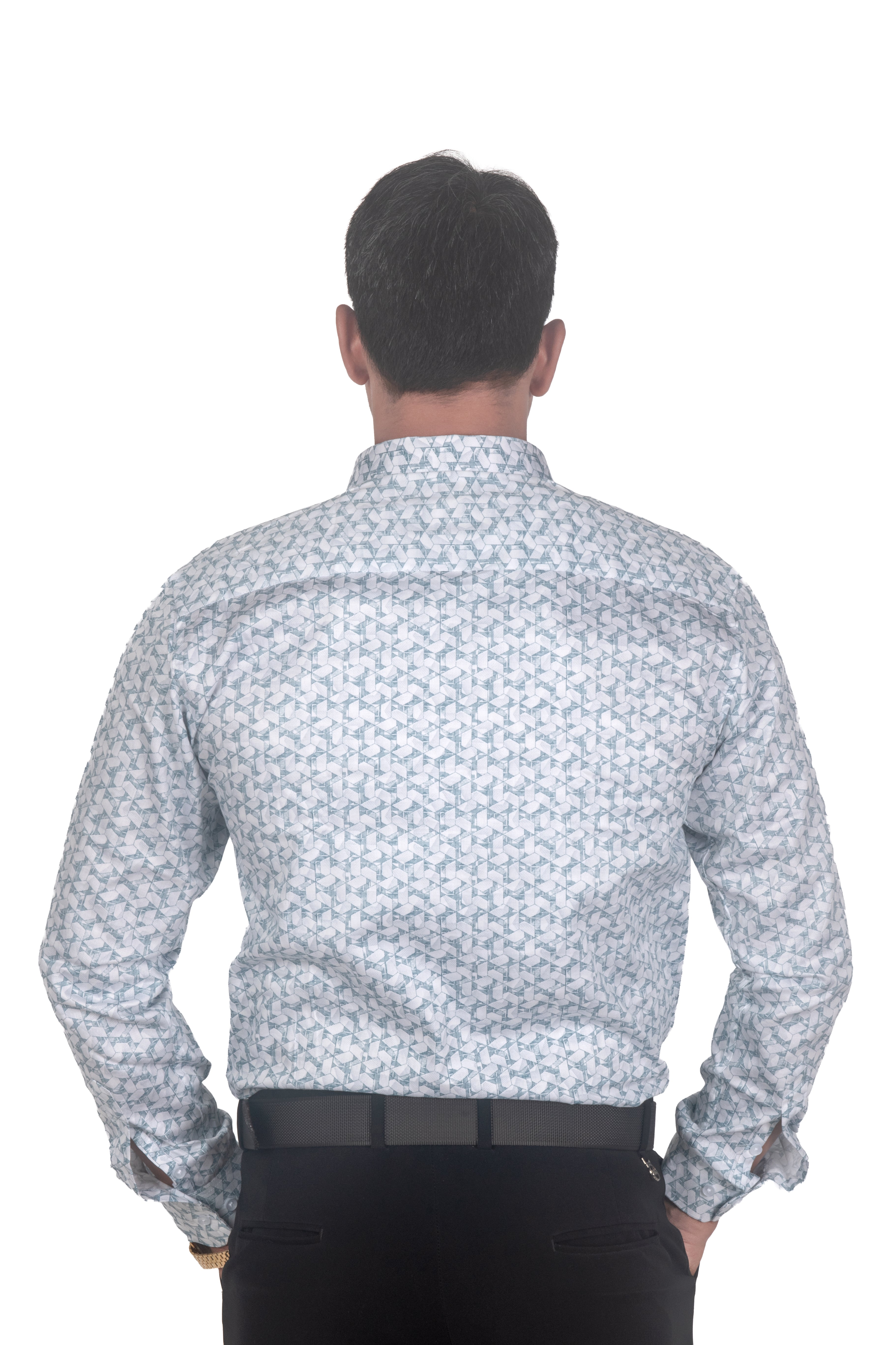 A man viewed from behind wearing a long-sleeve button-up shirt with a small repeating blue and white pattern, paired with black trousers and a black belt, against a plain white background.