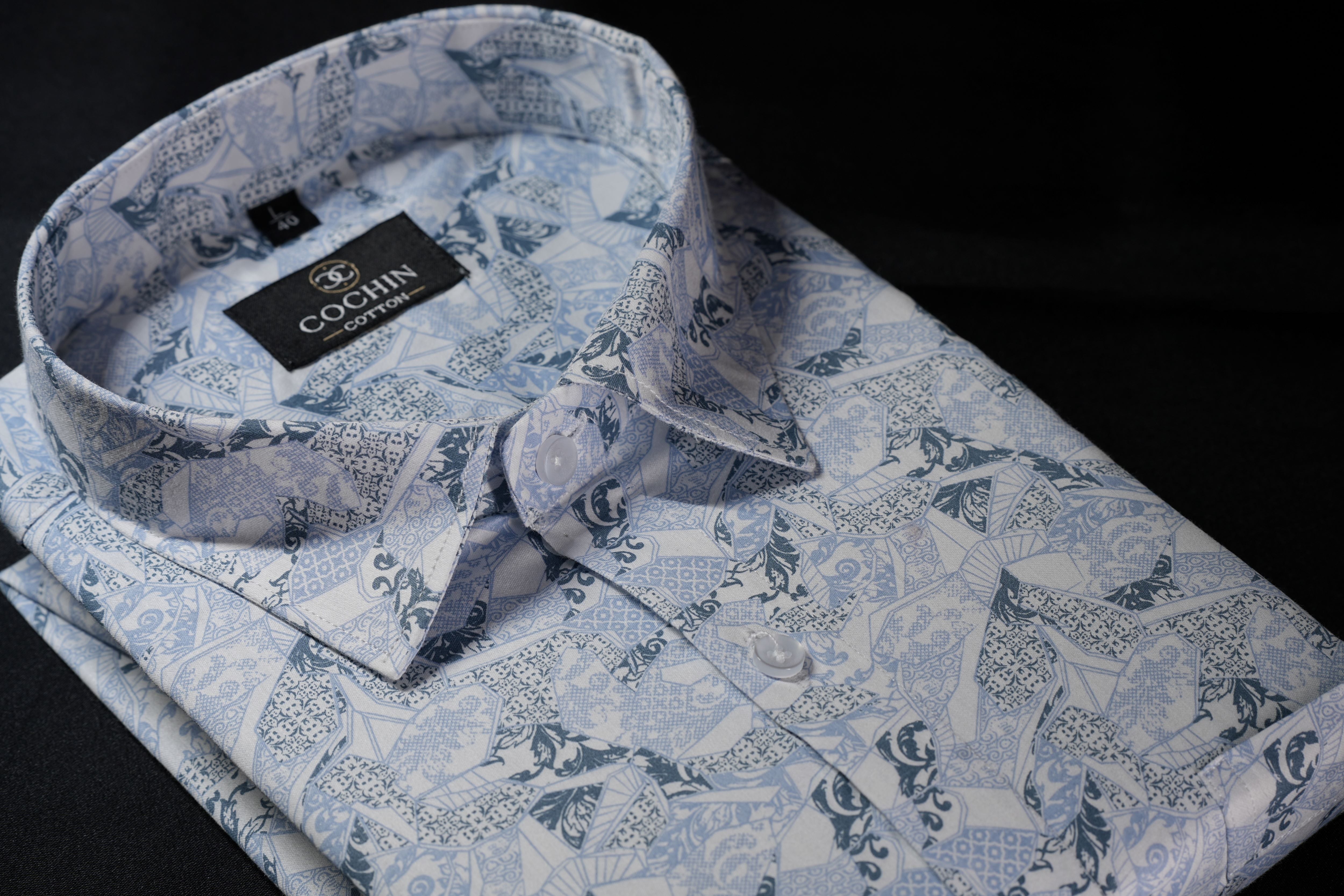 Folded blue patterned shirt with a Coats label on a black background