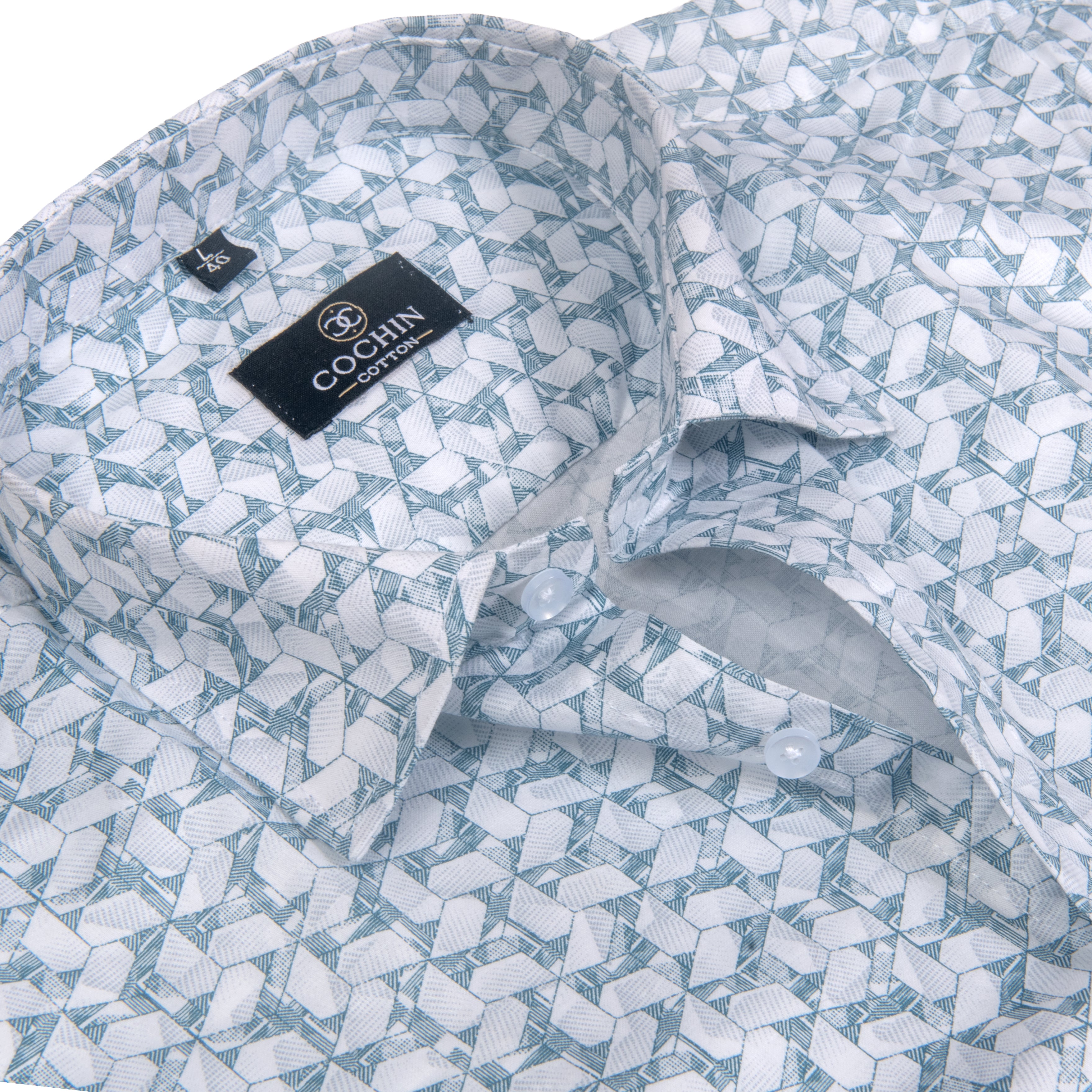 A close-up of a men's dress shirt by Cochin Couture, featuring a light blue and white geometric pattern on a clean white background.