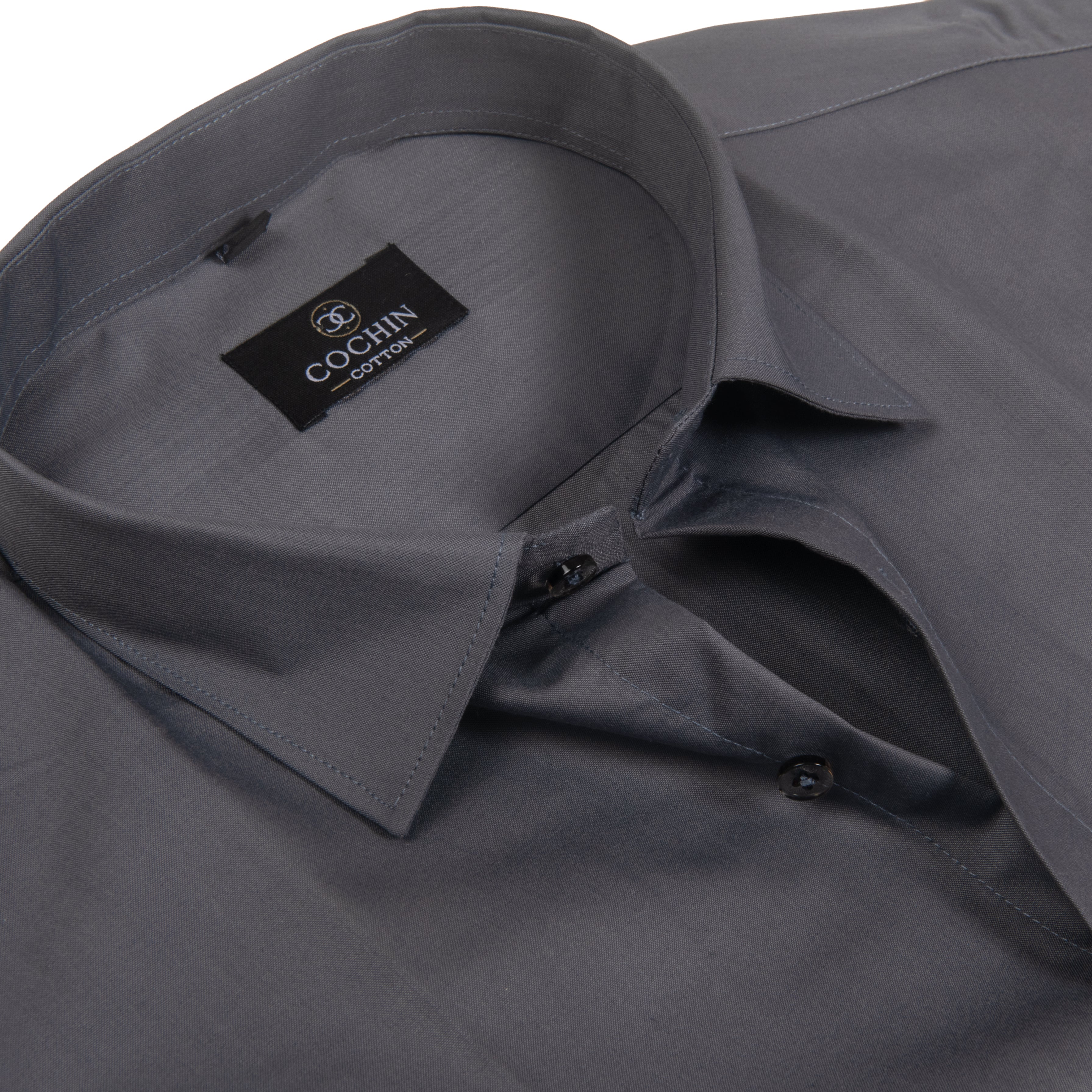 A close-up of a dark gray long-sleeve dress shirt, showing the inner collar with a black brand label that reads 'COCHIN cotton', and the front button placket.