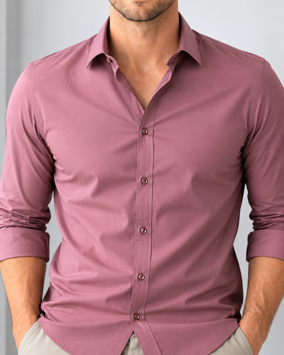 Mauve button-up shirt worn by a person against a gray background