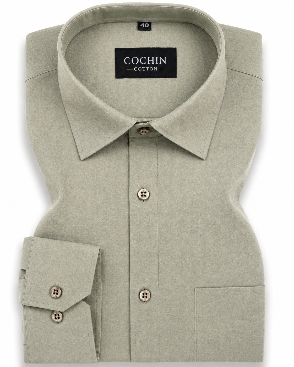 Folded light green shirt with 'Cochin Cotton' label on a white background